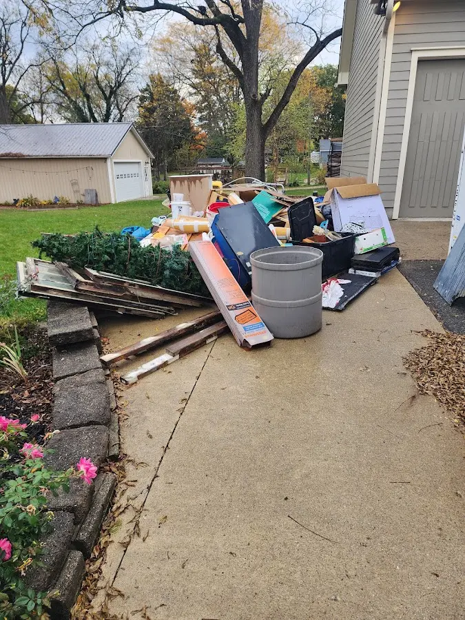 Dumpster being loaded with debris for Demolition Dumpster Rental in Hayden